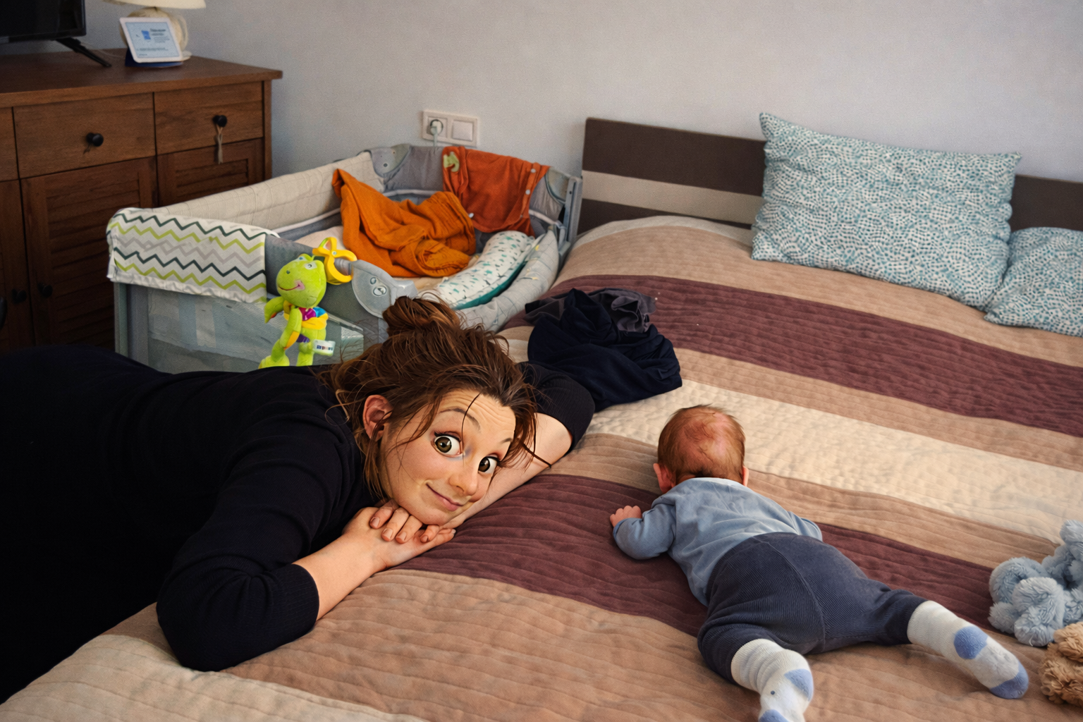 andie with newborn mike on the bed