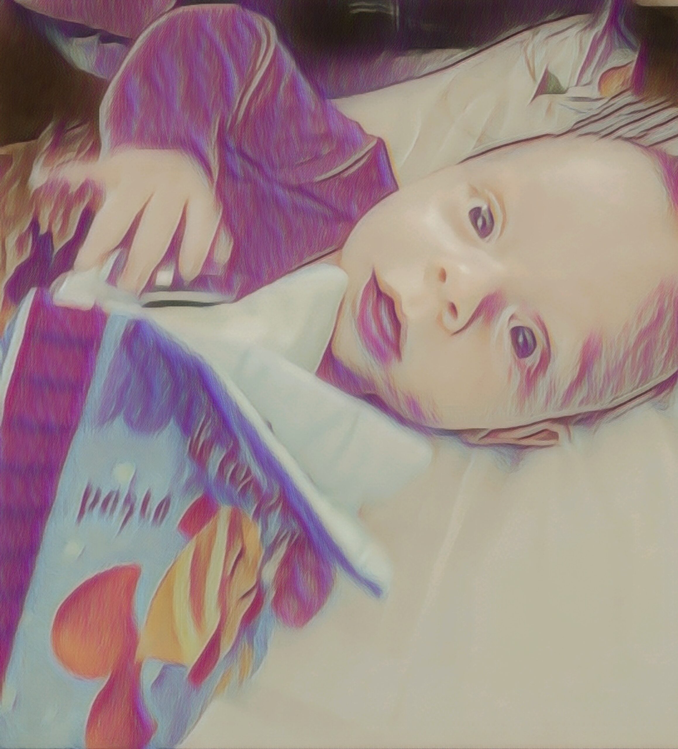 newborn mike with a baby book